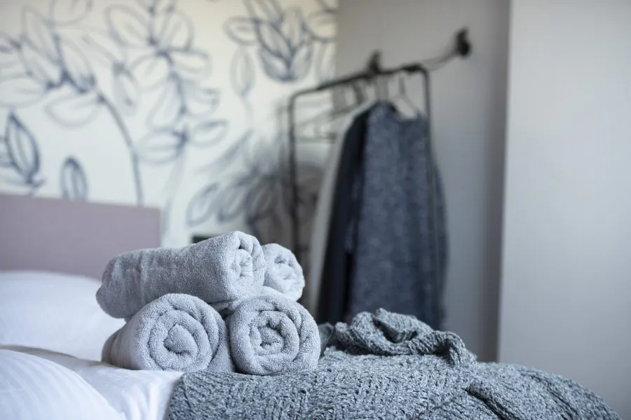 Towels on the bed in the suite