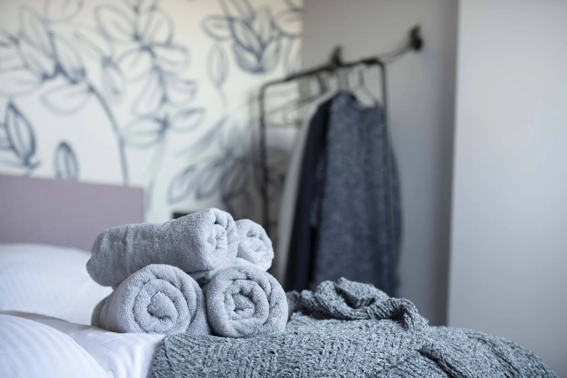 Towels on the bed in Suite 1